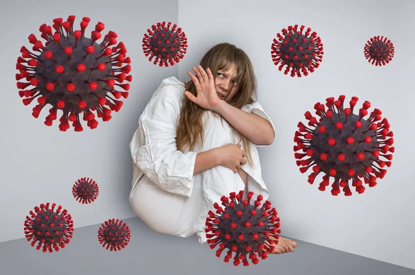 Scared woman in corner afraid of Coronavirus COVID-19 - 2019-nCoV virus concept