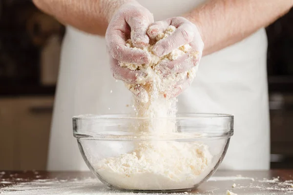 Pemanggangan Natal. Man in apron making dough for Christmas cookie — Stok Foto