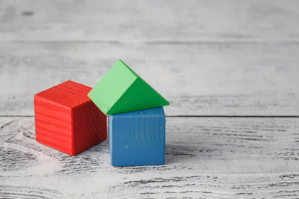 House with natural colored toy blocks