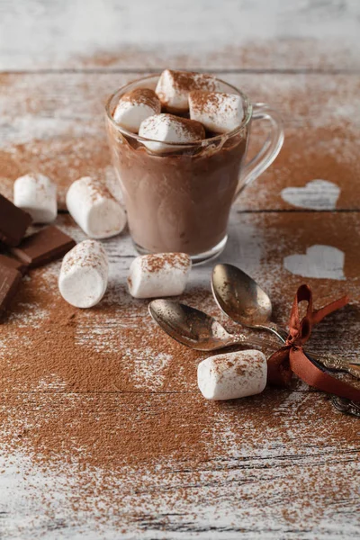 Cup of hot cocoa with marshmallows, cinnamon and chocolate on wo — Stock Photo, Image