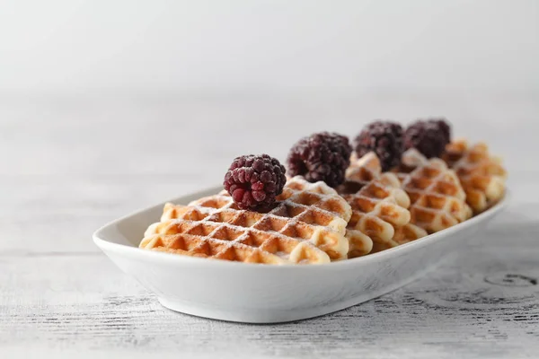 Brussels waffles with blackberries on white plate — Stock Photo, Image