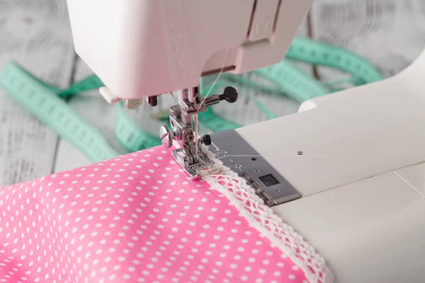 Leisure hobby concept, sewing machine at home with pink polkadot — Stock Photo, Image