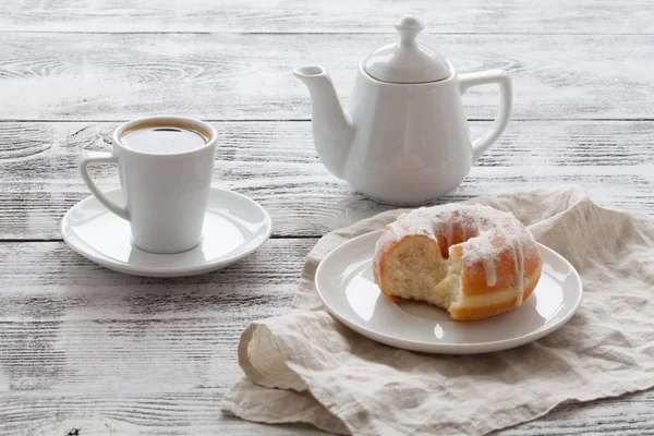 Coffee in white cup with fresh donuts — Stock Photo, Image