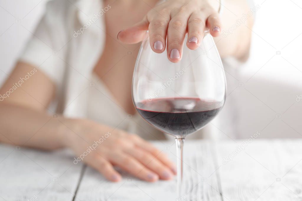 woman refused a glass of wine