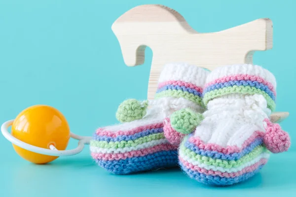 Cute toddler shoes on aquamarine background — Stock Photo, Image