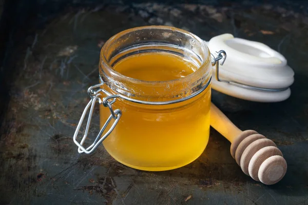 Full honey pot and honey stick — Stok Foto