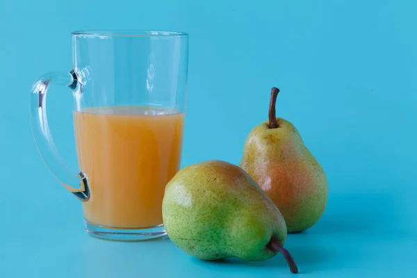 pear juice and fresh pears on the table