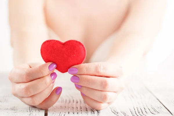 Female hands with red heart — Stock Photo, Image