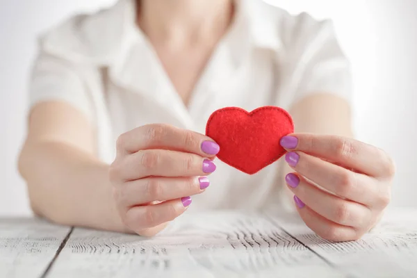 Female hands with red heart — Stock Photo, Image