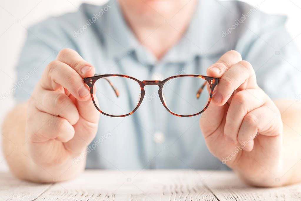 optometrist giving new glasses