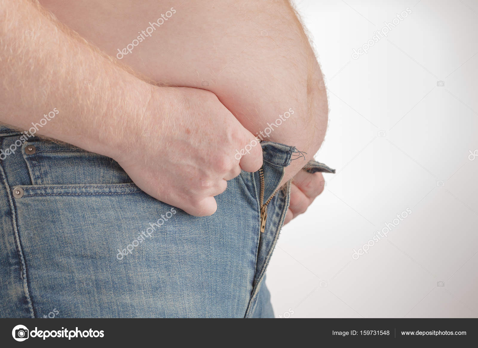 Fat man trying to put on pants. Big Paunch Stock Photo by ©AndreyCherkasov  159731548