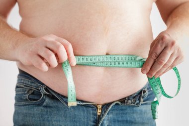 Fat man belly with measuring tape. Lose weight concept. clipart