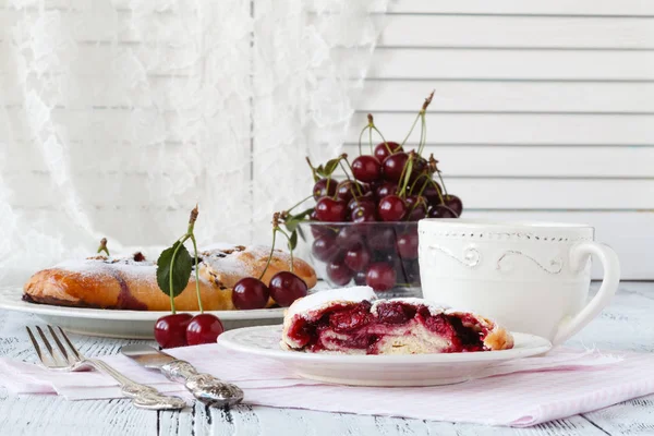 Slice of cherry pie with ice cream on a white textile background — Stock Photo, Image