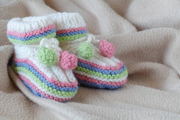 Newborn acessories, small shoes on soft background — Stock Photo, Image