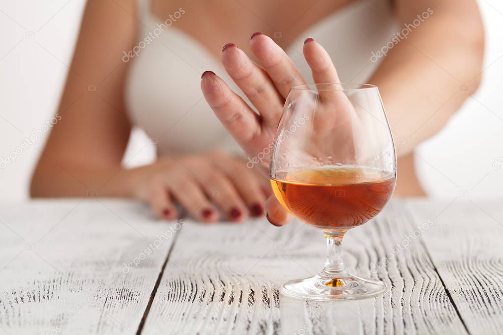 woman refuses to drink a alcohol