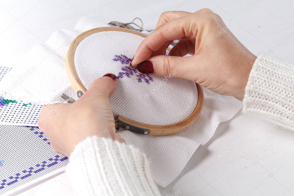 The process of working on a piece of embroidery, close-up