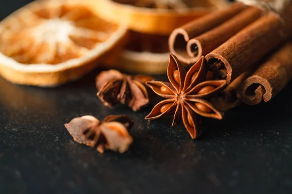 Bunch of cinnamon sticks with nutmeg and anise star — Stock Photo, Image