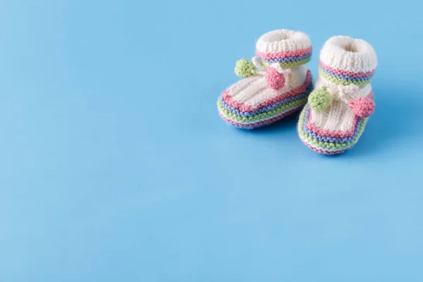 Infant announcement concept with newborn shoes — Stock Photo, Image
