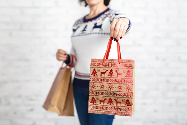 Find idea for gift, shopping bag in female hand
