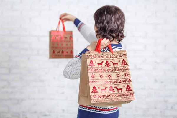 Find idea for gift, shopping bag in female hand