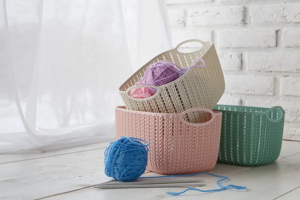 Leisure concept, home organizers colored baskets with handmade accessories