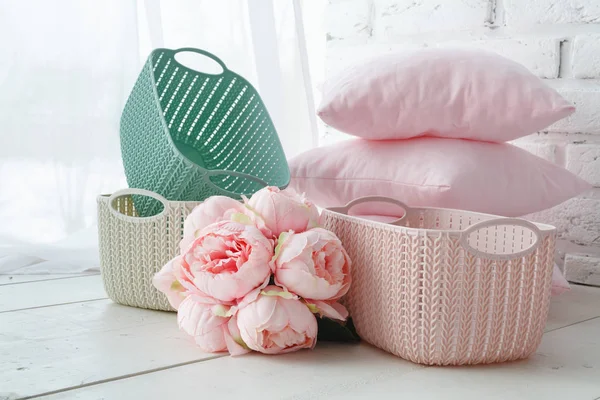 home organizers colored baskets with handmade accessories on whote table