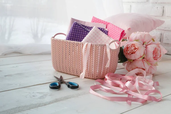 home organizers colored baskets with handmade accessories on whote table