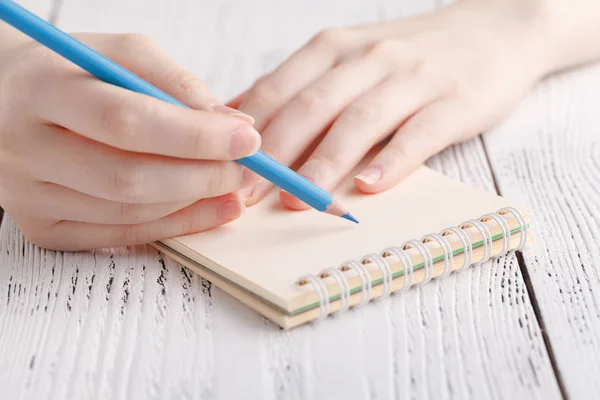Female painting in notebook — Stock Photo, Image