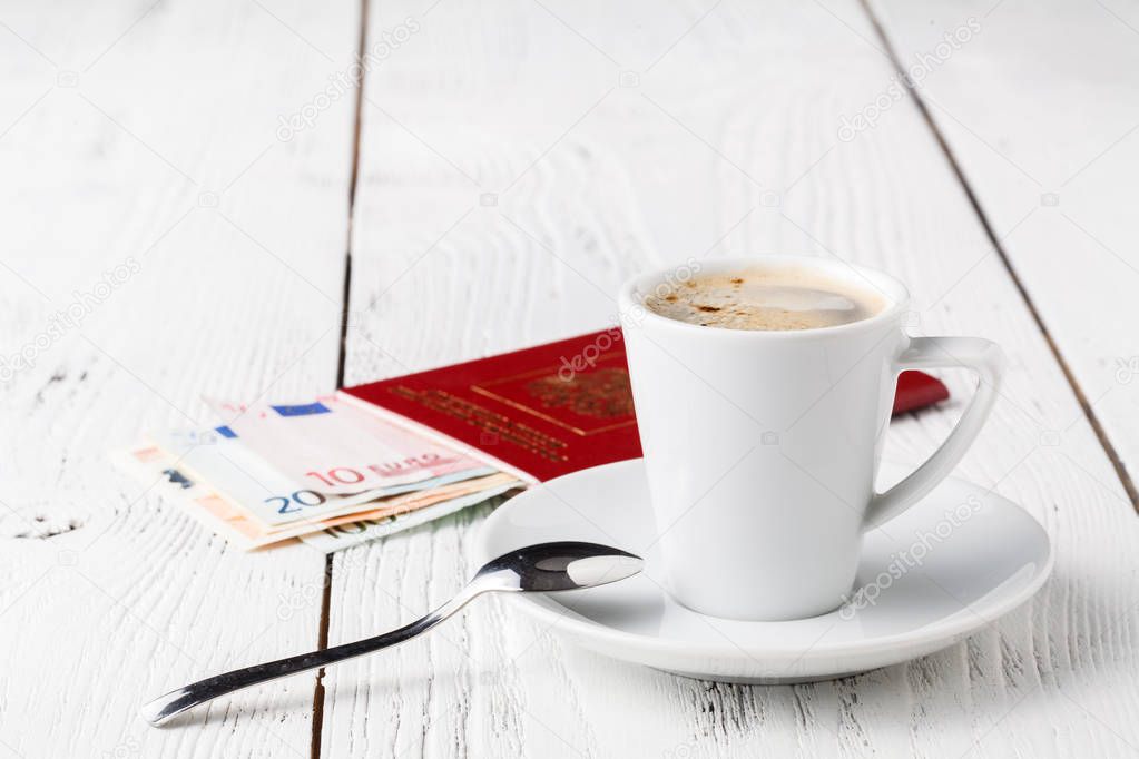 Cup of coffee, passports and no name boarding passes. Traveling concept