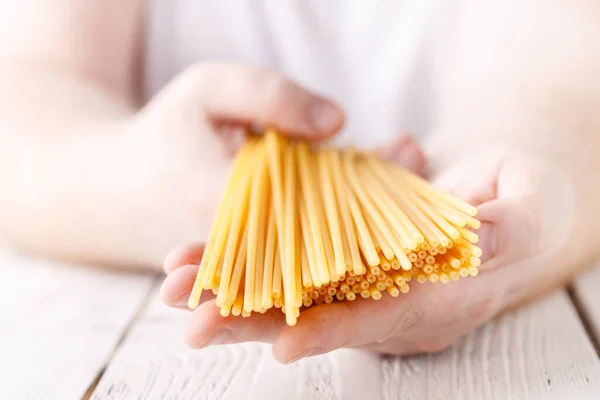 Hands Holding Spaghetti Kitchen — Stock Photo, Image