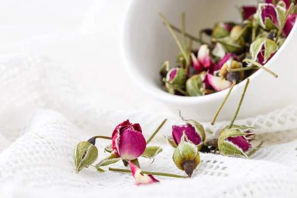 Floral tea with rose hips in bowl