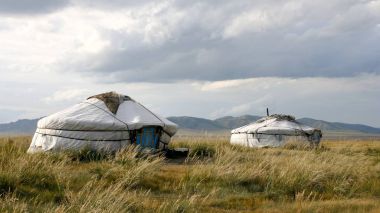 Yurts of nomads in the Siberian steppe. clipart