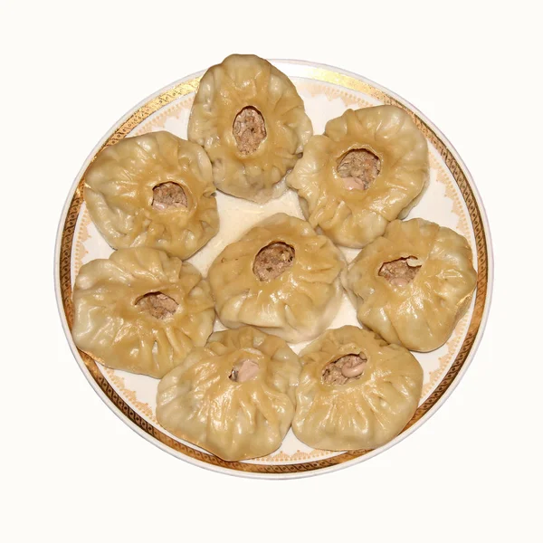 A plate of steamed dumplings. — Stock Photo, Image