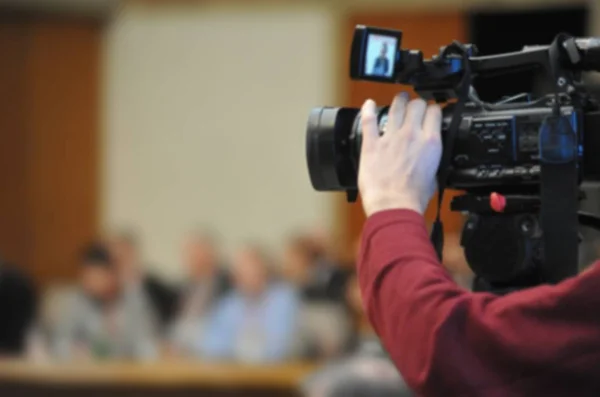 Fondo borroso abstracto de la grabación de la cámara de vídeo en la conferencia — Foto de Stock