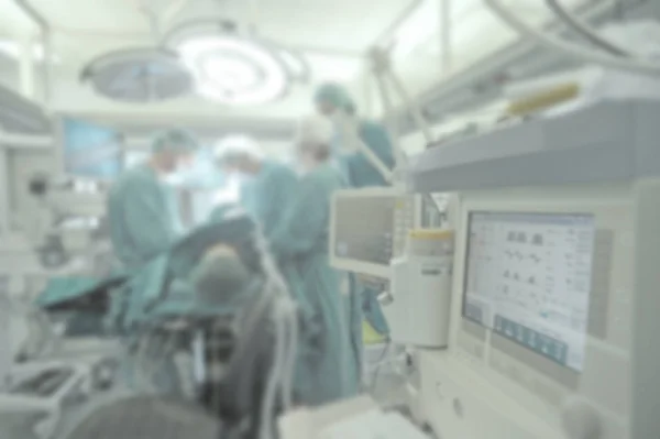 Surgical team operating on patient in theater in hospital blurred. — Stock Photo, Image