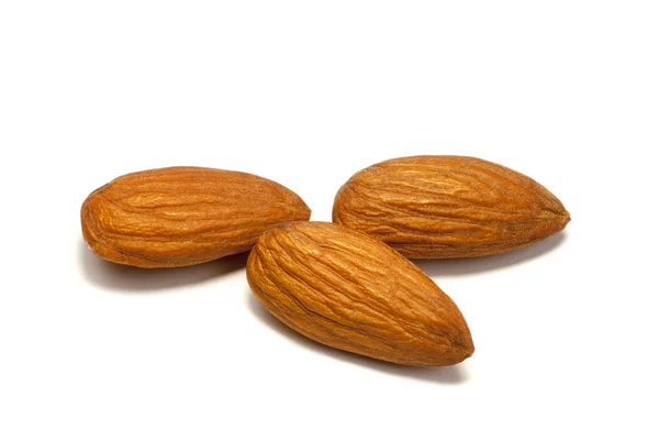 Some almonds isolated on the white background — Stock Photo, Image