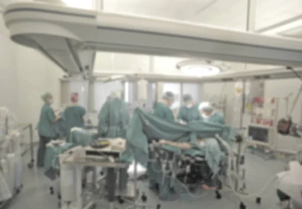 Chirurg zespół w pracy w sali operacyjnej, niewyraźne — Zdjęcie stockowe