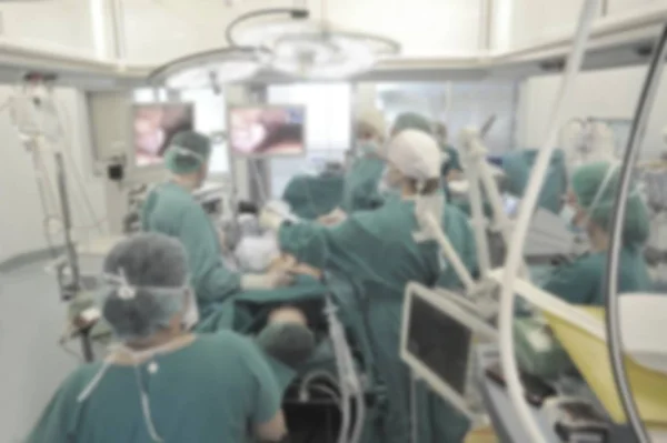 Team surgeon at work in operating room blurred — Stock Photo, Image