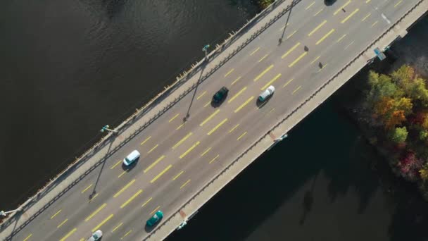 Aerial view, top down view of traffic on a bridge — ストック動画