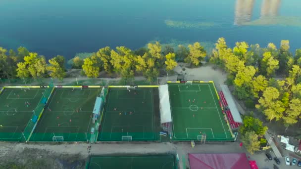 Soccer football fields in the park near the lake. — Stock Video