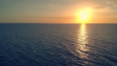 Colorful sunset above the sea surface