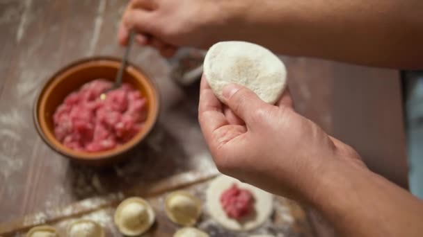 Preparing pelmeni or dumplings with meat. — Stock video