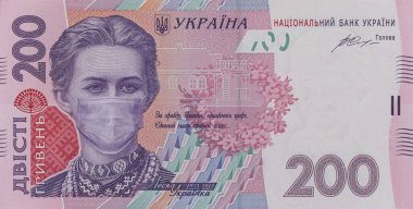 Ukrayna 'da COVID-19 koronavirüsü. 200 Hryvnia banknotu, Lesya Ukrayna 'nın sağlık maskeli hali. Küresel mali ve ekonomik kriz Ukrayna 'yı etkiledi. Ukrayna parası, koronavirüs konsepti, montaj