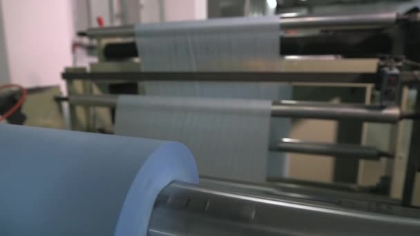 Roll of spunbond fabric for medical clothes — Stock video