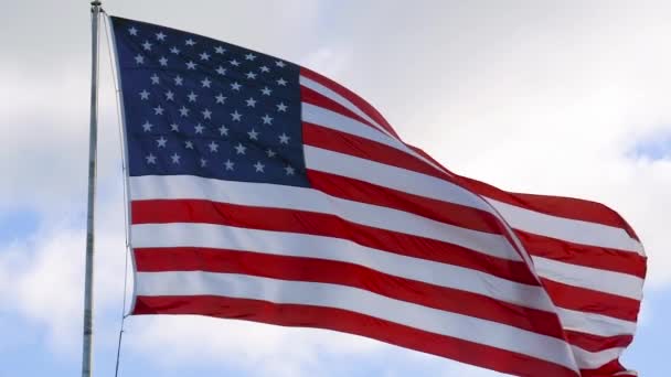 American USA flag on flagpole waving, slow motion