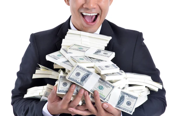 Een heleboel geld in de handen van een jonge zakenman. — Stockfoto