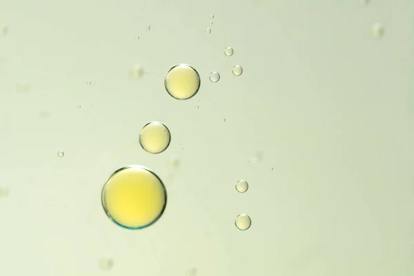 Yellow bubbles over a blurred background — Stock Photo, Image