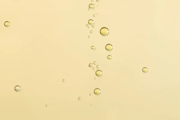 Yellow fizz  over a blurred background — Stok Foto