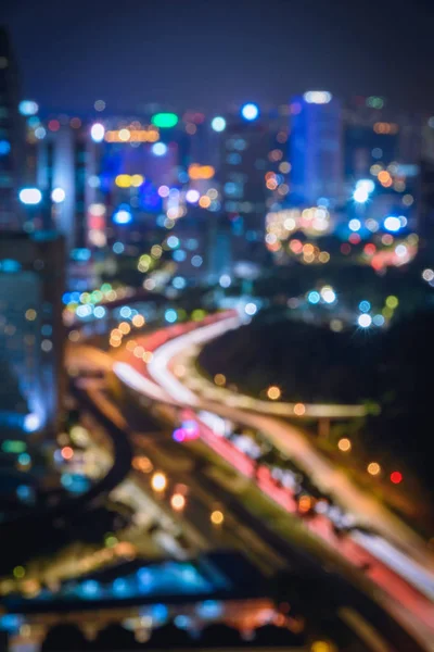 Bulanık arka plan ışıkları, güzel şehir manzarası Kuala lumpur şehir silueti geceleri Malezya 'da.