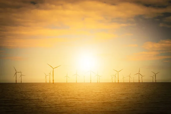 Sunset Offshore Wind Turbine in a Wind farm under construction off the England coast — Stock Photo, Image